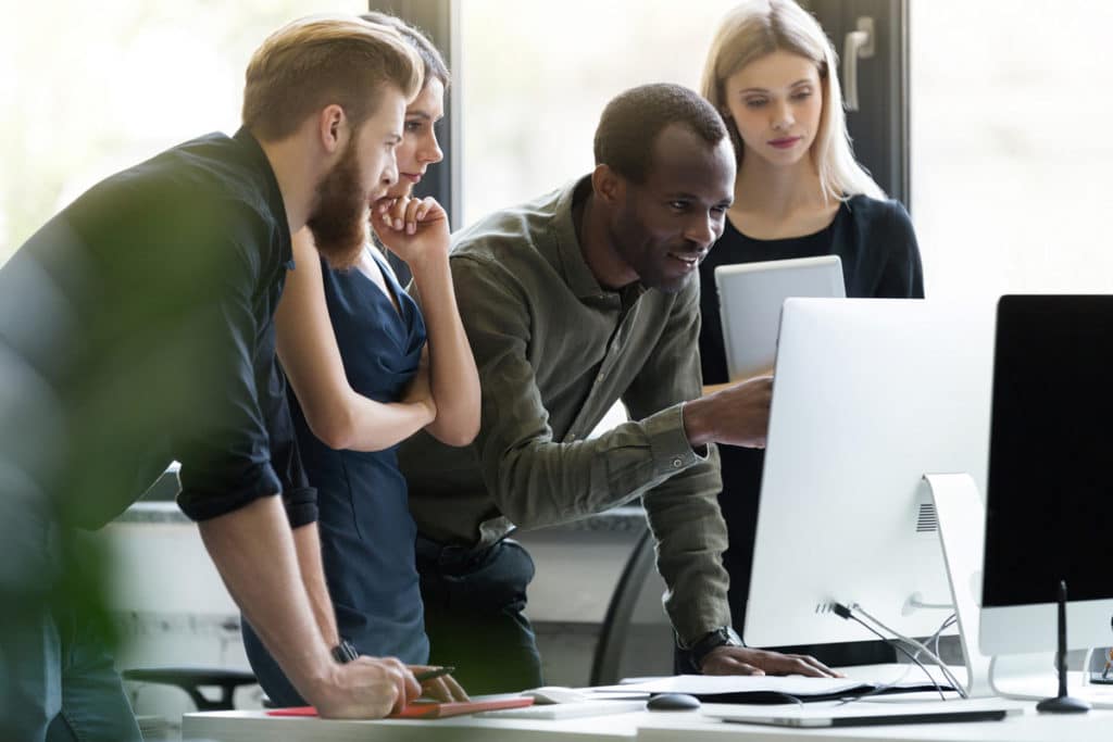 group-of-young-businesspeople-in-meeting-at-office_web